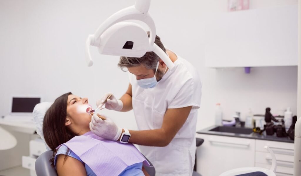 dentist examining female patient teeth 1170x684 1